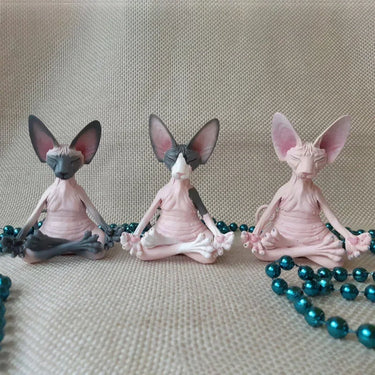 The Peaceful Meditating Cat Sanctuary Statues by KittyNook Cat Co. feature three serene cats in mindful meditation poses.